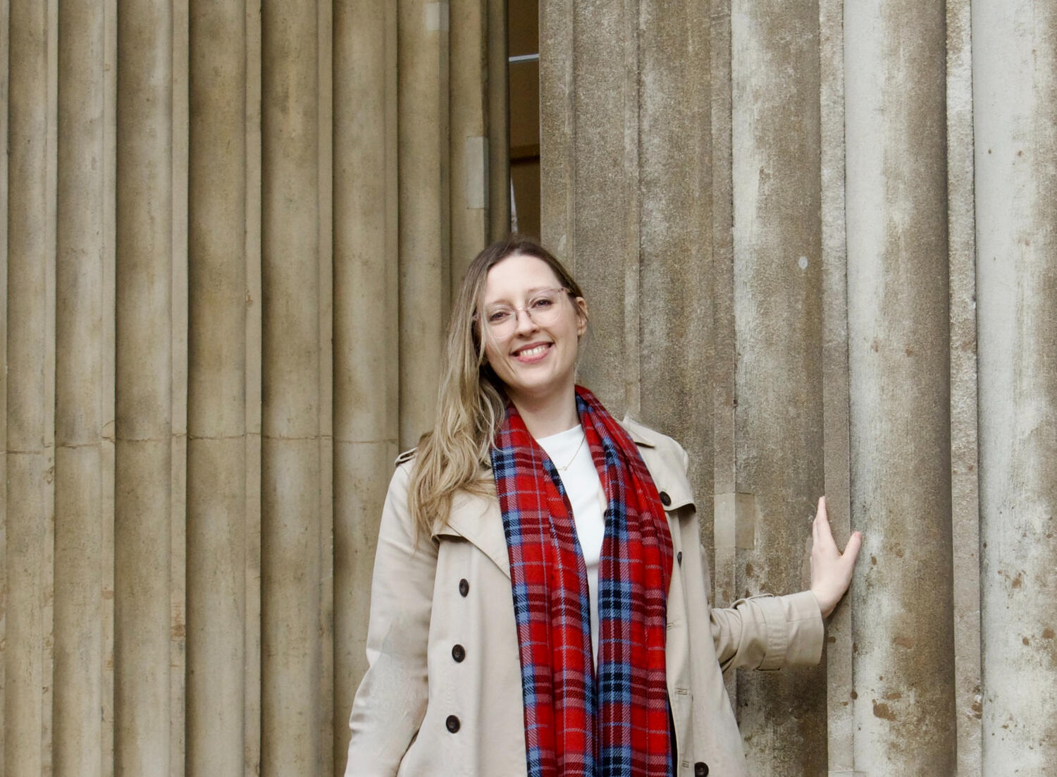 A photograph of a woman outside of the British Museum.